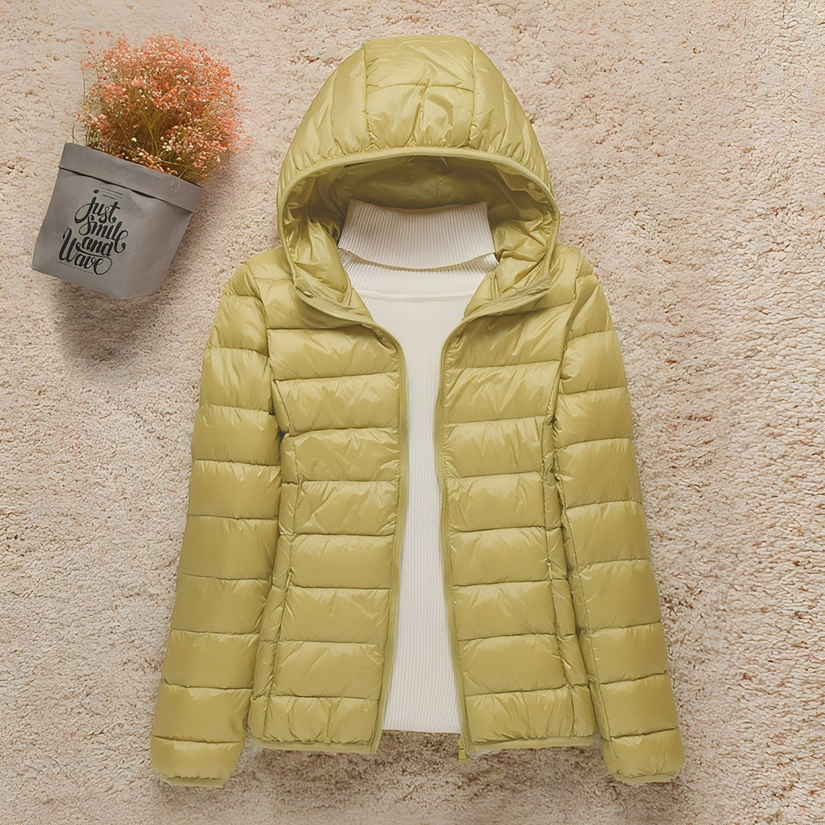 Women's Compressible Hiking Down Jacket staged on a neutral background - Powder Pink - Navy Blue - Navy Blue (without hood) - Orange - Beige - Beige (without hood) - Mint Green - Mint Green (without hood) - Pink - Blue - Purple - Purple (without hood) - Red - Red (without hood) - Black - Black (without hood) - Burgundy - Burgundy (without hood)