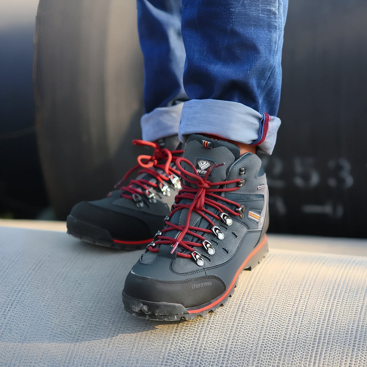 Men's Mountain Hiking Shoe worn on foot - Black and Orange - Navy Blue and Gray - Gray and Red