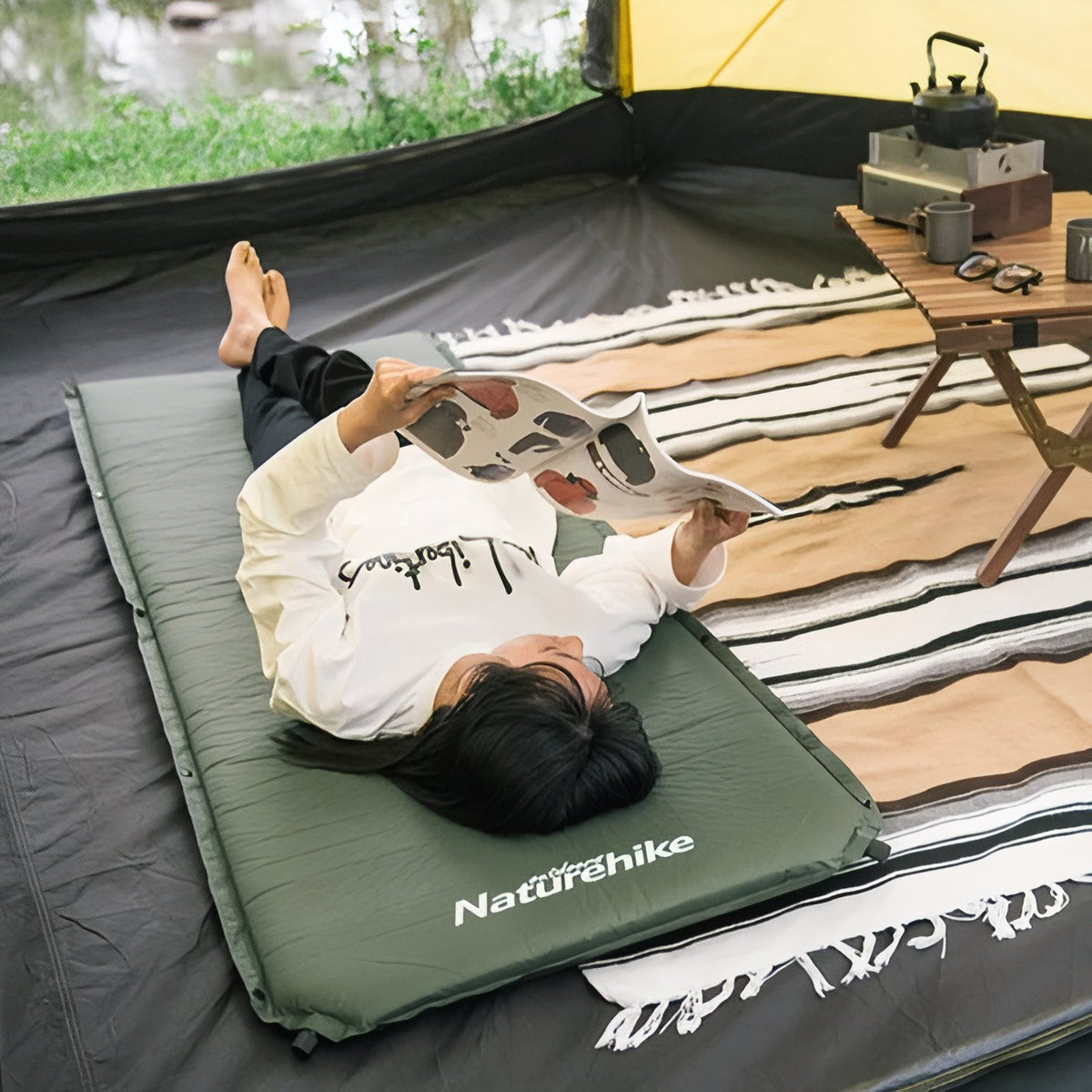 Self-Inflating Camping Mattress 1 Person person reading magazine - Dark Green - Dark Gray - Light Beige