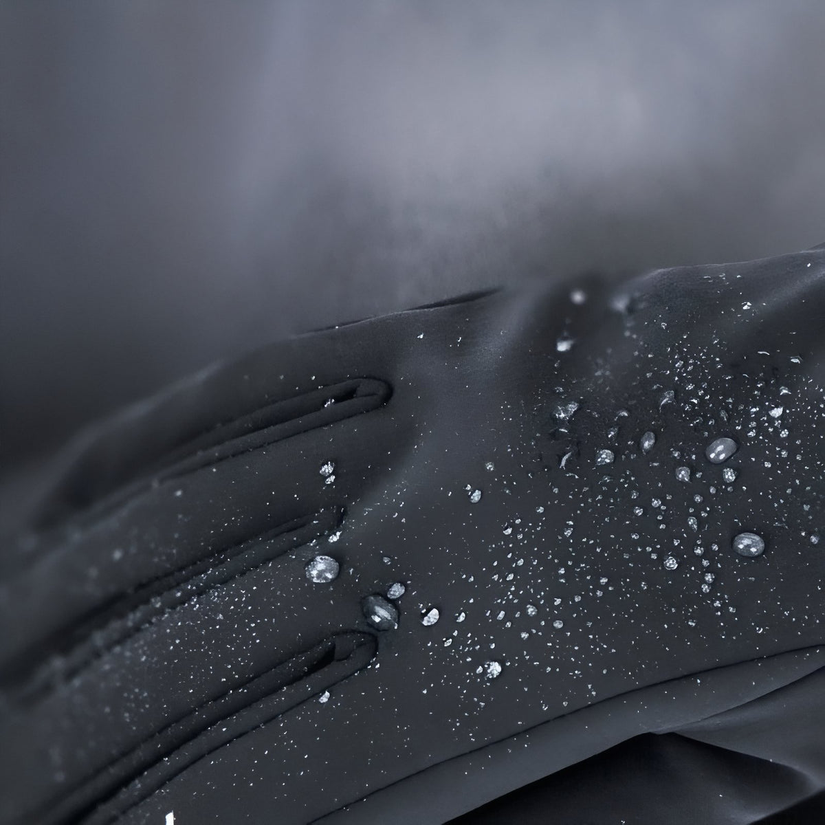 Close-up of Waterproof Hiking Gloves with water droplets - Black - Blue - Anthracite